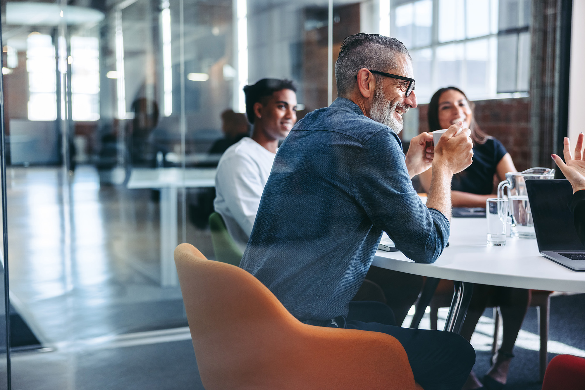 Businessman attending a meeting with his team